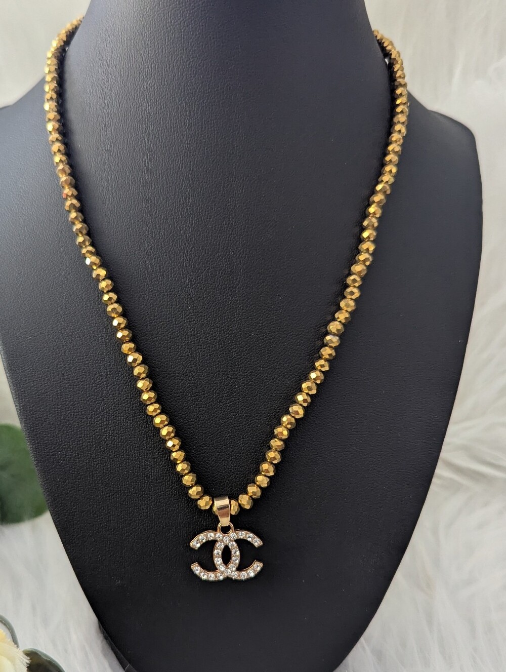 Gold Beaded Necklace with Crystal Logo Pendant
